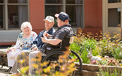 Skilled Nursing near Morrisville NY image of elderly people sitting outside from Crouse Community Center