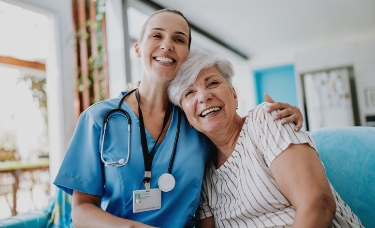 nurse hugging patient short term rehab near syracuse ny