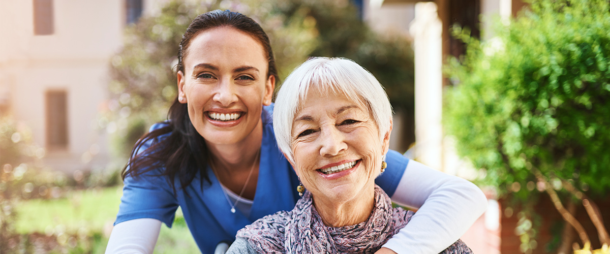 Support Us Today near morrisville ny image of elderly woman smiling with nurse from Crouse Community Center