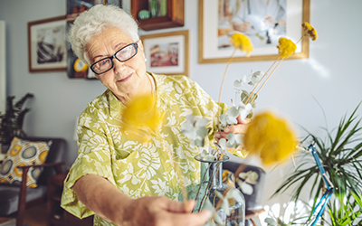 long term care near morrisville ny image of senior citizen with flowers in vase