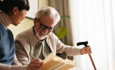 nurse reading with patient long term care near syracuse ny