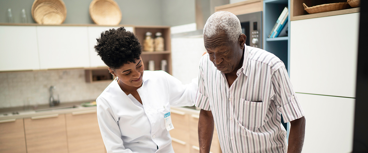 short term rehab near morrisville ny image of medical professional assisting elderly man from crouse community center