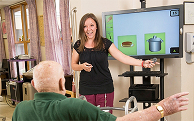 Rehabilitation near morrisville ny image of woman giving presentation from Crouse Community Center