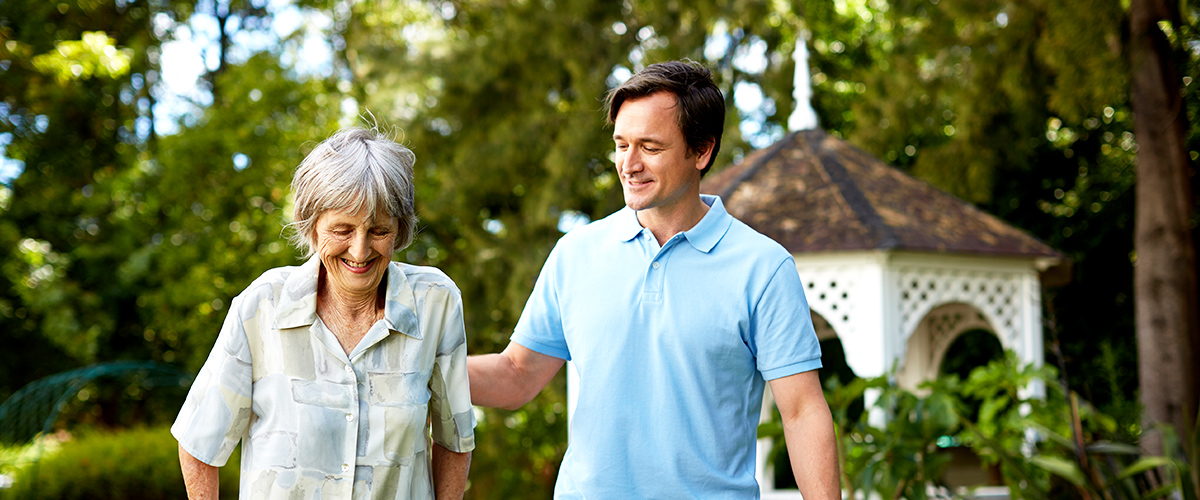 fall prevention for the elderly near morrisville ny image of staff assisting elderly patient outside